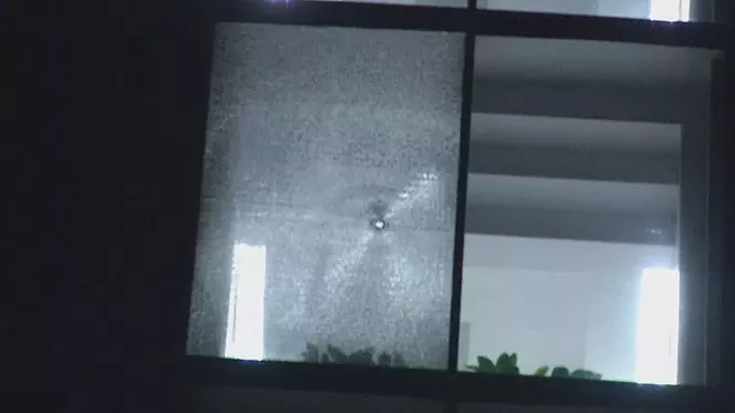 Shots shattered windows at a pair of buildings housing ICE offices in San Antonio early Tuesday morning. - TWITTER / DLOESCH