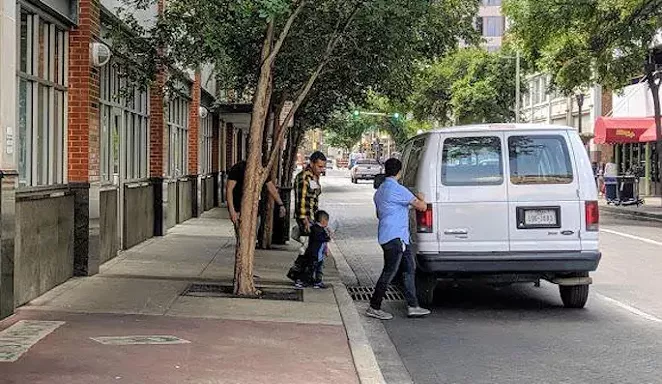 Asylum seekers leave the city's Migrant Assistance Center. - TWITTER / @TPRNEWS
