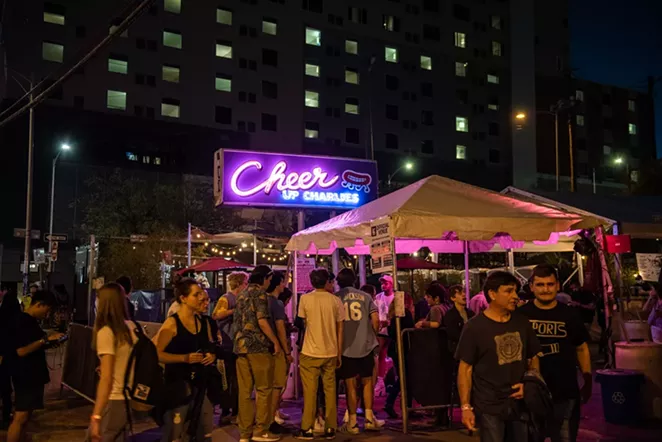Festival attendees crowd downtown Austin streets at last year's SXSW. - JAIME MONZON