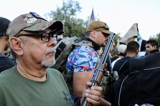TITFF members engage in a heated standoff with protestors. - JAMES DOBBINS
