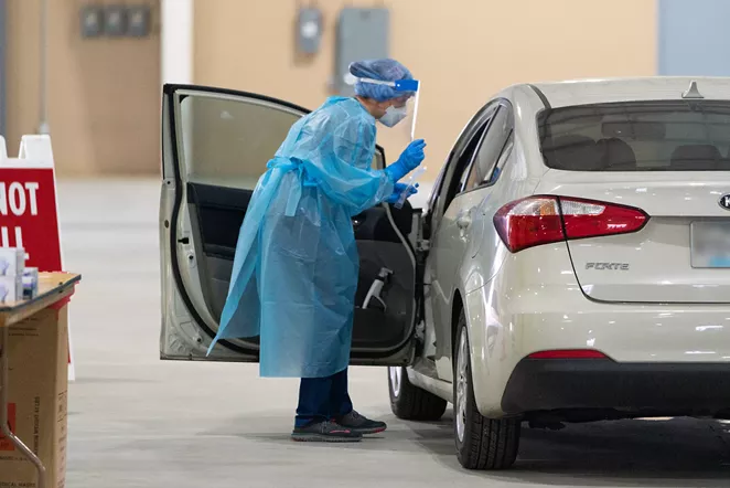 A worker at a drive through coronavirus testing center in San Antonio prepares to swab a visitor. - COURTESY PHOTO / CITY OF SAN ANTONIO