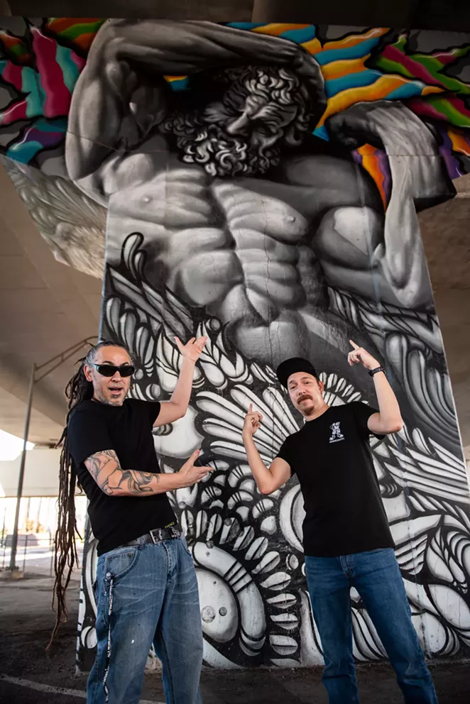 Nik Soupè and David “Shek” Vega show off their work under Interstate 35, just north of downtown San Antonio. - JAIME MONZON