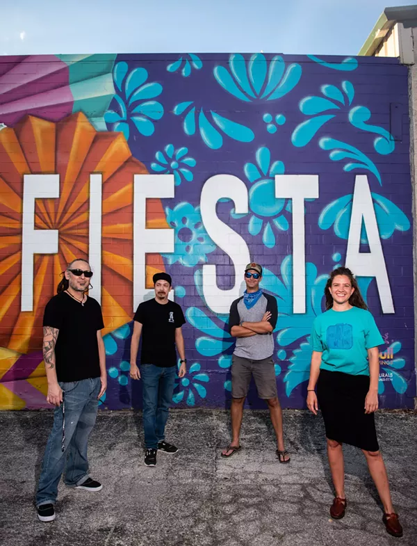 Nik Soupè, David “Shek” Vega, Matt Tumlinson and Eva Marengo Sanchez (left to right) show off mural work on the St. Mary’s Strip. - JAIME MONZON