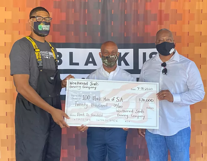 Weathered Souls founder Marcus Baskerville (L) presents a check to 100 Black Men of San Antonio President Ivory M. Freeman (C) and Executive Director Dr. Milton Harris (R). - COURTESY WEATHERED SOULS BREWING