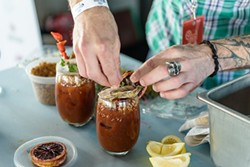 Chef Crumley prepares his competition-winning Bloody Mary, complete with oyster garnish, at United We Brunch 2020. - JAIME MONZON