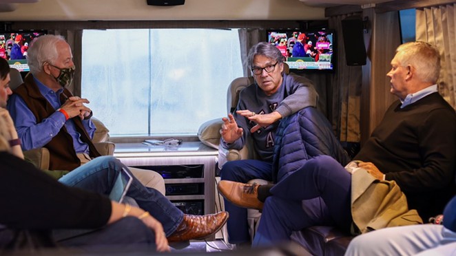 John Cornyn (left) and Rick Perry (center) converse in the senator's campaign bus on the way to College Station. - TWITTER / @TEAMCORNYN