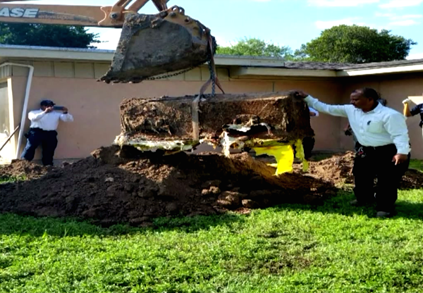 A coffin was found buried in a backyard on Elm St. - DEEDEE OLIVEIRA