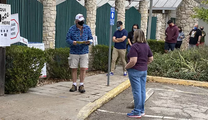 Voters line up outside of the Lion's Field polling site in San Antonio. - SANFORD NOWLIN