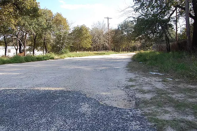 The few stretches of pavement in Highland Oaks quickly give way to sand. - MICHAEL MARKS