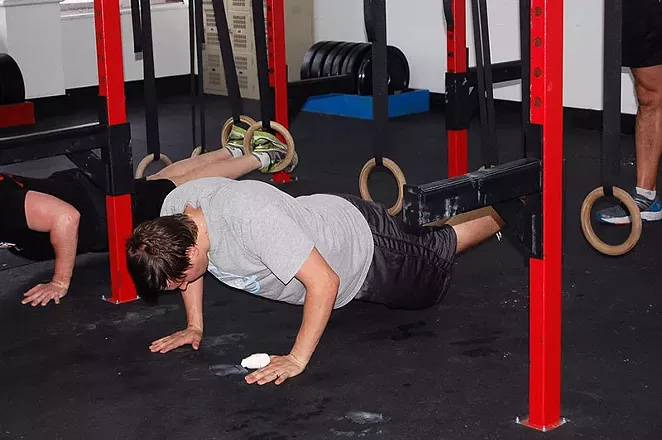 Our intrepid reporter does pushups. Kind of. - SARAH MCGHEE
