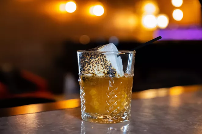 The Campfire Marshmallow Old Fashioned is topped with a flame-toasted marshmallow. - KODY MELTON