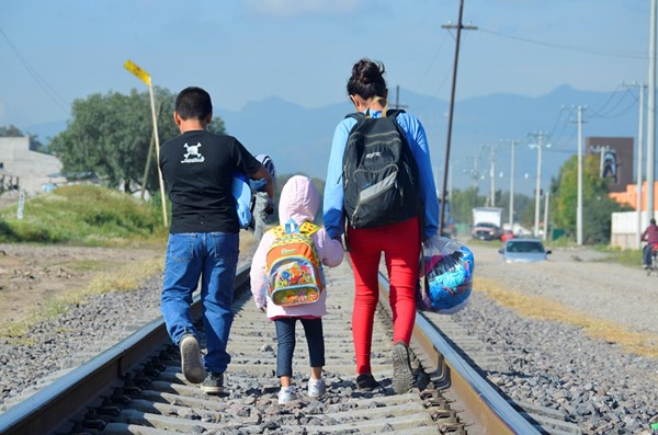 A 16-year-old girl and her two younger siblings are seen in this December 10, 2014, near a catholic charity that serves migrants at a nearby train station. The trio was in Mexico. They were trying to reach the U.S. from Honduras. - © UNICEF/UNI176266/OJEDA