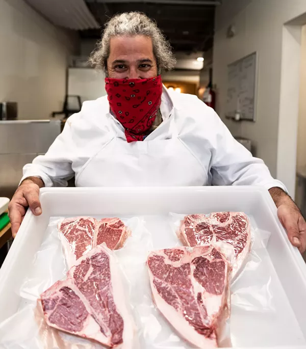 Heritage hog farmer Mark Escobedo shows off locally sourced beef cuts. - JAIME MONZON