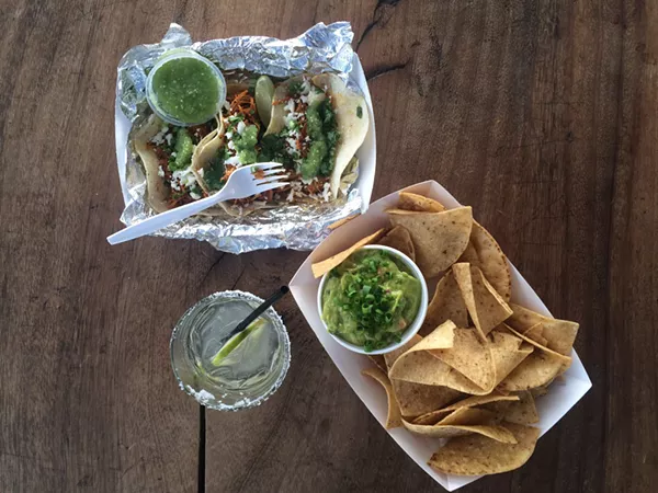 Pollo pibil tacos, chips & guacamole, and a margarita
