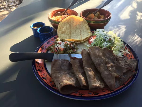 Cecina Asada de Yecapixtla with nopalitos, tortillas, guacamole, salsa, and sides