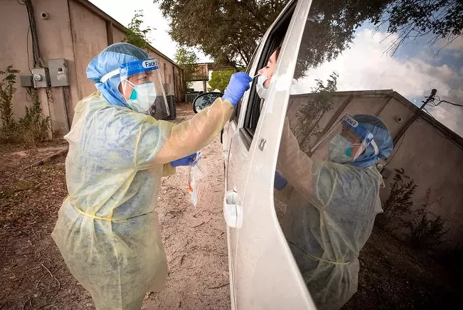 Patients are tested for COVID-19 at the Community Action Health Center in Falfurrias on Nov. 13, 2020. - JASON GARZA / THE TEXAS TRIBUNE