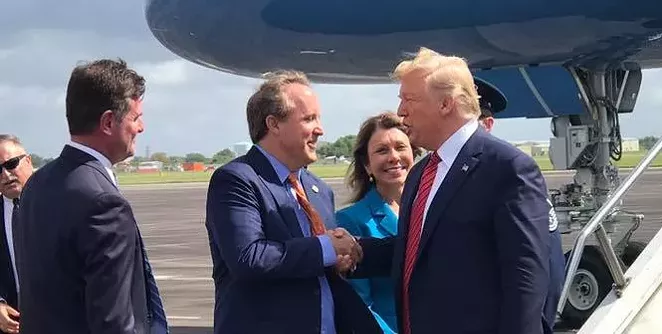 Texas AG Ken Paxton (center) meets President Donald Trump on the Tarmac during a 2019 presidential visit to Houston. - FACEBOOK / KEN PAXTON