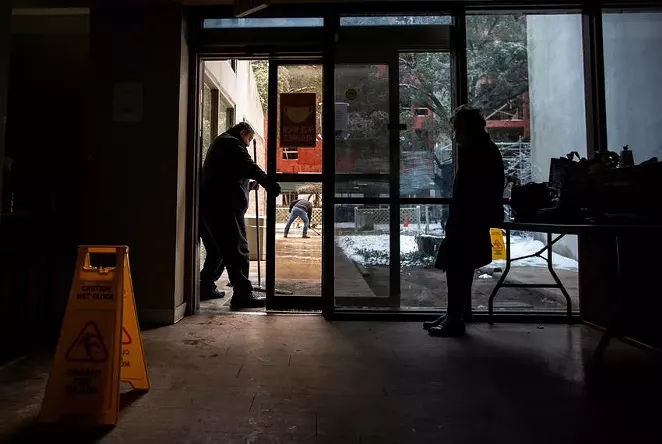 Carmen Pena, right, waited for a ride Feb. 17 at the Rebekah Baines Johnson Center, an independent living center in Austin that lost power during the storm. - MONTINIQUE MONROE / THE TEXAS TRIBUNE