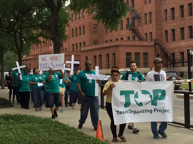 Texas Organizing Project members march in front of the Bexar County Courthouse during 2019 protest for bail reform. - TIFFANY HOGUE