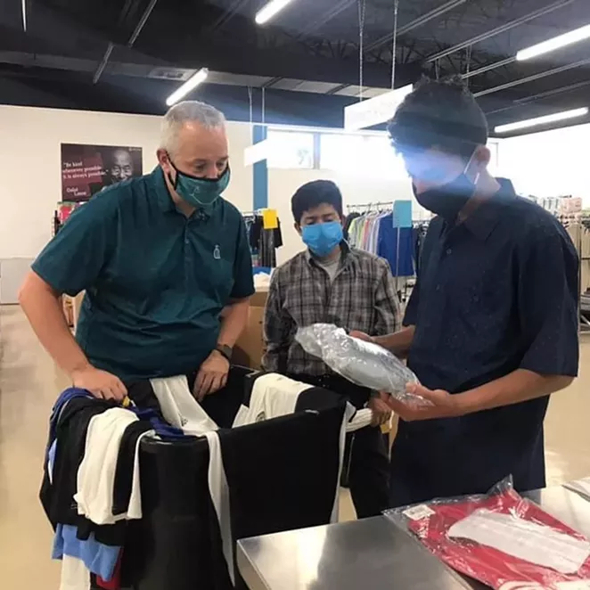 A pair of migrant youths are released from Freeman Coliseum into the care of Catholic Charities President and CEO J. Antonio Fernandez. - INSTAGRAM / CATHOLIC CHARITIES OF SAN ANTONIO