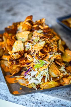 Loaded chips topped with spicy chicken will be a menu option at Tex's. - PHOTO COURTESY TEX'S HOT CHICKEN