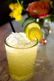 The El Cosmico cocktail features a blend of reposado tequila, mezcal, chartreuse and passionfruit. - SIDECAR AT THE PRINCE SOLMS INN