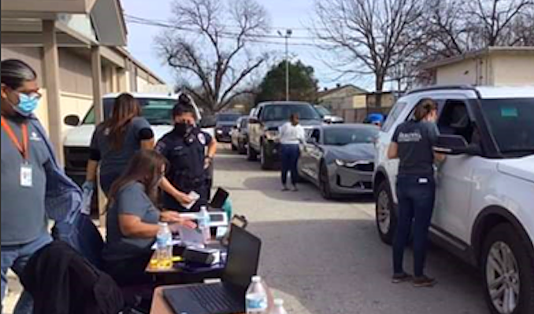 Workers administer Pfizer vaccines at a recent Metro Health mobile clinic. - COURTESY PHOTO / METRO HEALTH