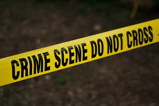 Police officers stretched this crime scene tape around the scene of a crime committed by other police officers in celebration of Prop B's defeat. - PEXELS / KAT WILCOX