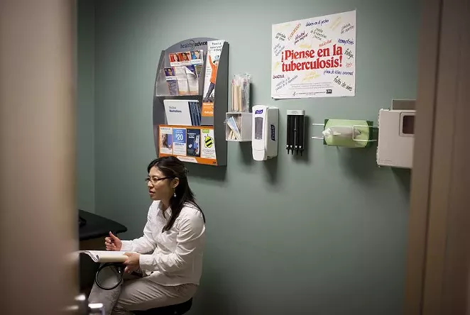 Sonia Wood, a certified pediatric nurse practitioner, treats a patient at Carousel Pediatrics in Austin. Three million children are currently on Medicaid, but most of their parents do not qualify.
