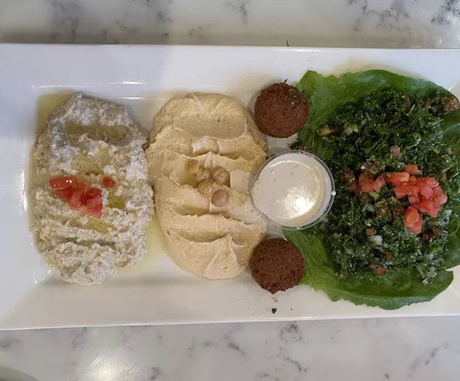 Zaatar’s hummus is classically creamy and presented simply, although a spicy version is also available. - RON BECHTOL