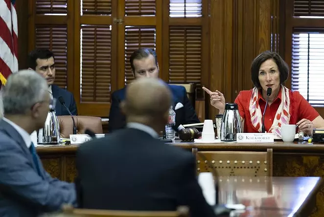 State Sen. Lois Kolkhorst, R-Brenham, chair of the Senate Committee on Health & Human Services, listens to Dr. Esmaeil Porsa, left, CEO of Harris Health System; and Dr. Joseph Chang, chief medical officer of the Parkland hospital system, testify on the statewide crisis due to COVID-19 hospitalizations on Aug. 10, 2021. - TEXAS TRIBUNE / SOPHIE PARK