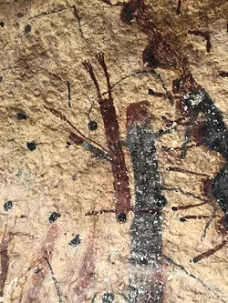 A closeup of the multicolored images at the White Shaman site. - BILL BAIRD