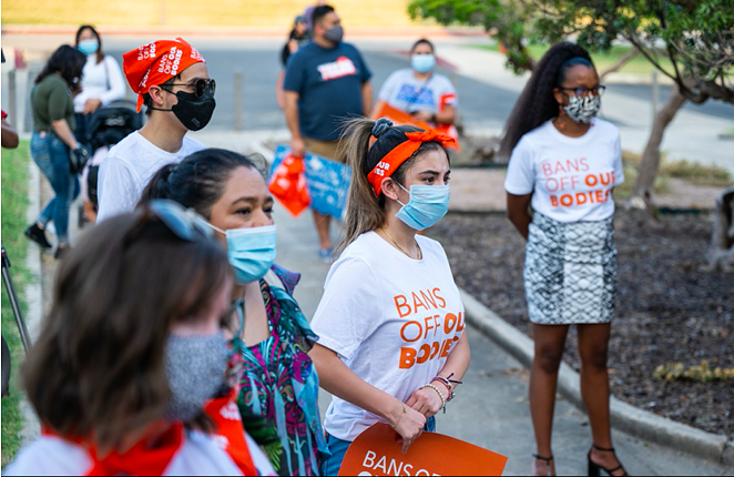 Protesters listen intently to a speaker at a San Antonio rally against the Texas abortion ban. - JAIME MONZON