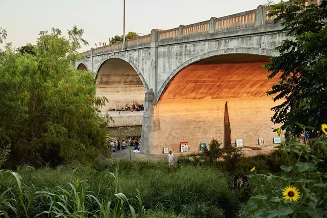 People gather under the Roosevelt Avenue Bridge on June 21 for a concert organized by the Echo Bridge Appreciation Society. - SA HERON / TYLER SMITH