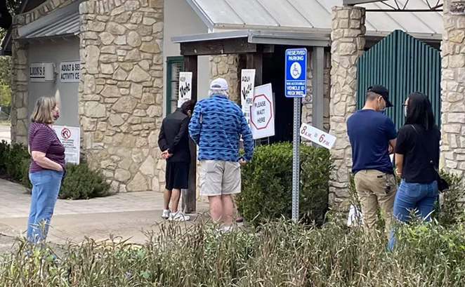 Voters wait in line to vote at Lion's Field in San Antonio. - SANFORD NOWLIN