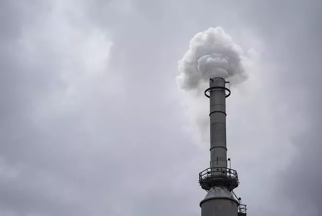 Smoke is released from a power plant in San Antonio in August. The power grid's failure during a February winter storm spurred state lawmakers to formalize the Texas Energy Reliability Council, a 25-member body tasked with fostering communication and planning to improve how the grid functions.