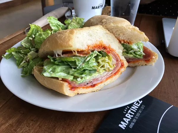 The Grand Tano with mortadella, salami cotto, soppressata, provolone, garlic mayo, pepperoncini in a hoagie roll. - JESSICA ELIZARRARAS