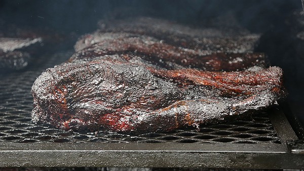 Briskets on the smoker outside of Garcia’s Mexican Food. - BENJAMIN OLIVO / THE TACOIST