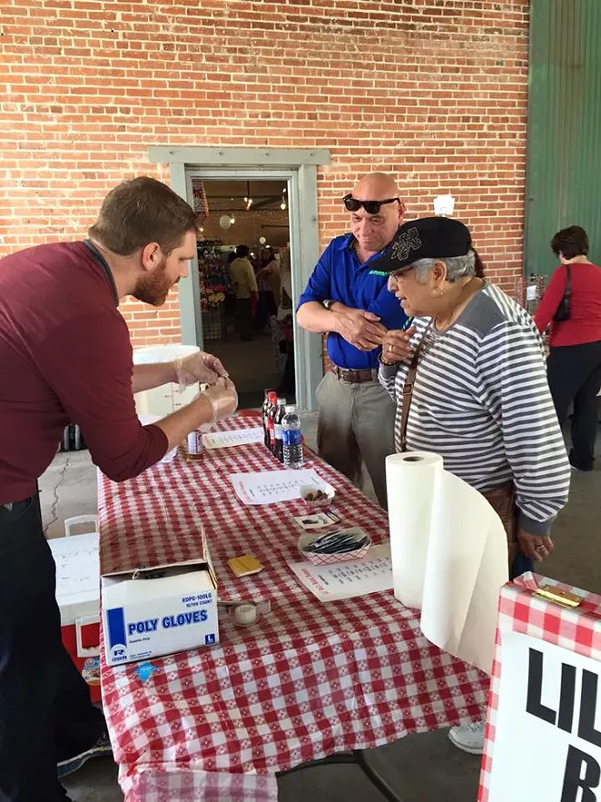 McAndrews explaining how to eat boiled peanuts at the South Flores Market in 2016 - FACEBOOK/LIL' RED'S BOILED PEANUTS