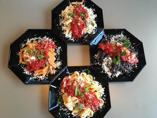 Counter-clockwise from top: Quinoa and rice fusilli, black bean rotini, Banza shells and red lentil sedanini. - RON BECHTOL