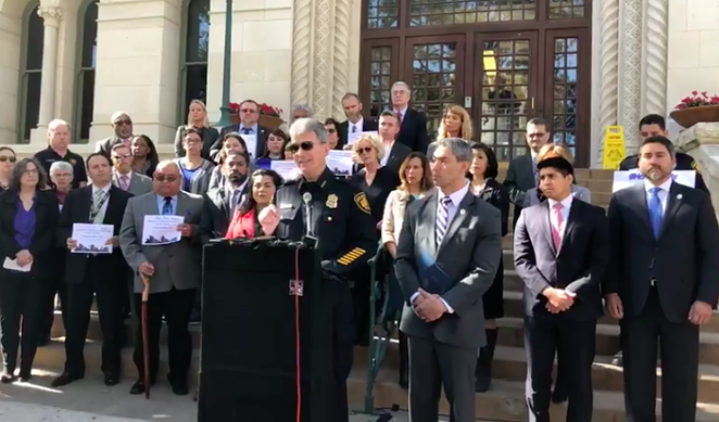 Chief McManus, flanked by San Antonio officials, at Thursday's press conference. - ALEX ZIELINSKI