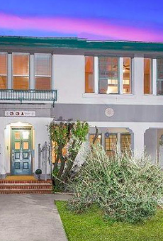 This historic San Antonio home comes with a rooftop deck and an awesome view of downtown