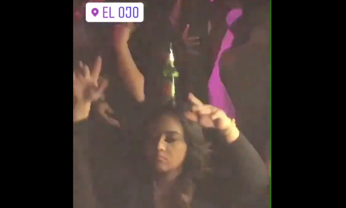 this girl dancing with a beer on her head at el ojo might just be
