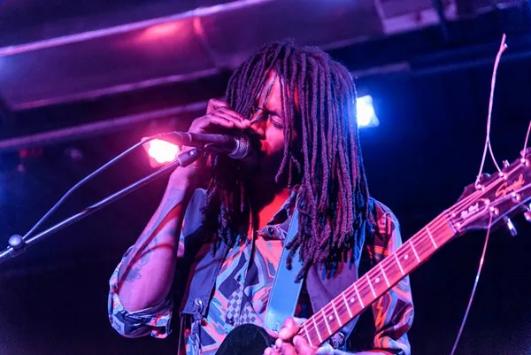 Lonely Horse frontman Nic Long sings emotively into the mic. - JAIME MONZON