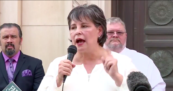 Cynthia Brehm speaks at a recent rally at which she claimed the coronavirus pandemic is a Democratic hoax. - TWITTER VIDEO CAPTURE / @BUBBAPROG