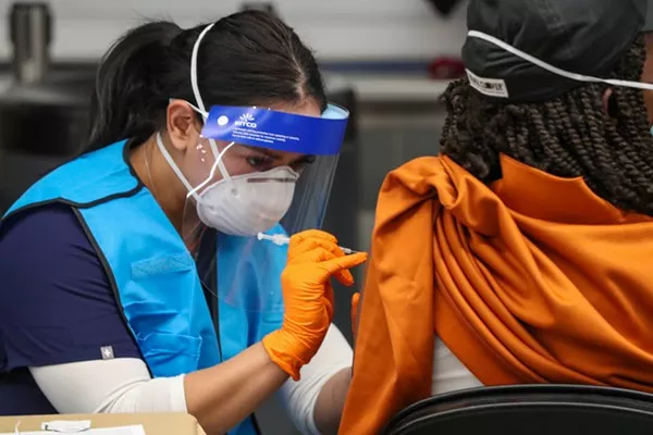 A woman receives a vaccination at a San Antonio immunization clinic. Experts say online disinformation has hindered health officials' ability to get vaccines into the arms of people who need them. - COURTESY PHOTO / CITY OF SAN ANTONIO