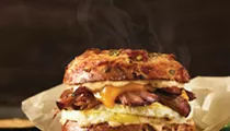 Einstein Bros. Bagels debuts uber-Texan breakfast sammie, featuring slow-smoked brisket