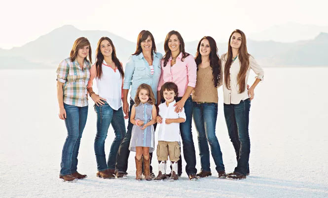 Allison Carr, in blue shirt, with her wife and children - COURTESY ALLISON CARR