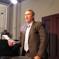 Former Attorney General Mark Shurtleff reading a statement at a press conference in response to his July 15 arrest for 10 felony corruption charges