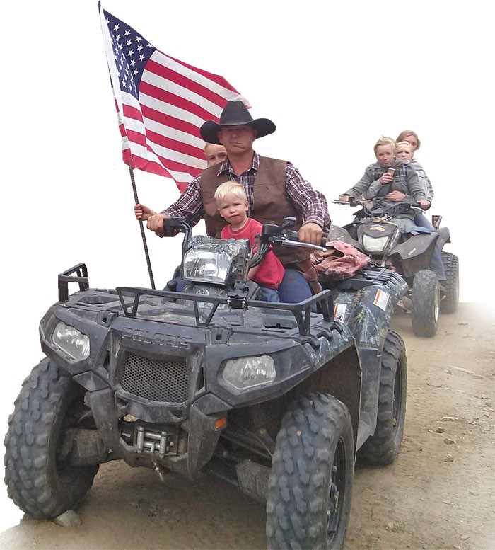 Ryan Bundy, son of Nevada rancher Cliven Bundy, rides his ATV through Recapture Canyon - ERIC TRENBEATH